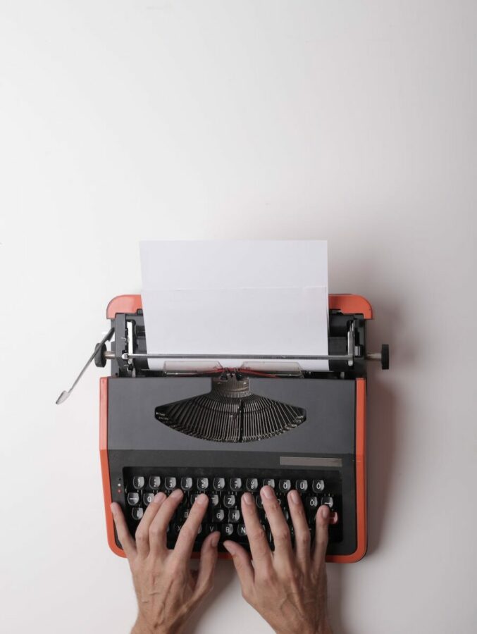 writer working on typewriter in office